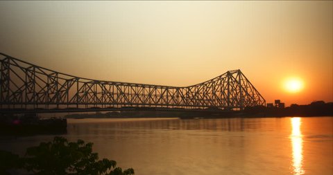 Time lapse of sunset with the Howrah Bridge in busy Calcutta, India.