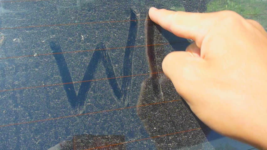 Man writes wash me on car windshield.