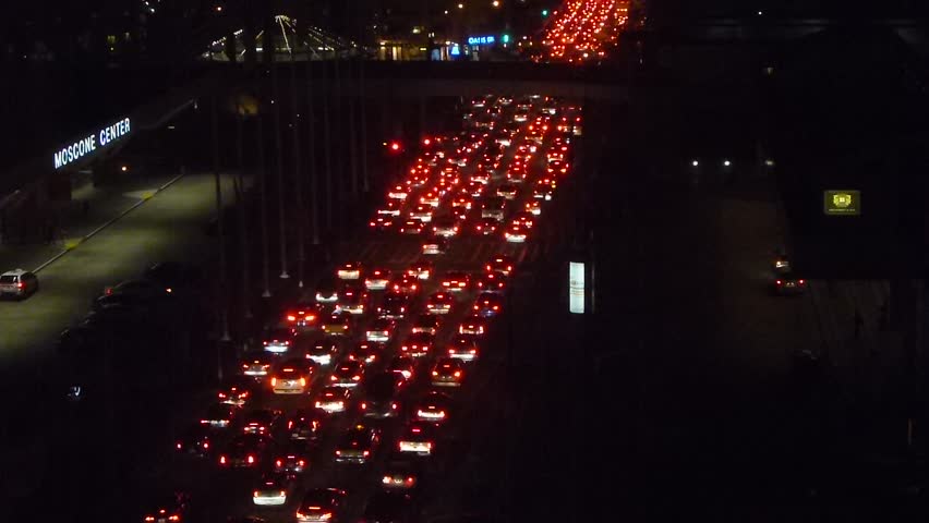 Rush hour traffic at night in downtown San Francisco, California.