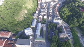 Flying over a new residential complex in the center of Kiev in the historical part of the city. Aerial View. Video 4k. Ukraine. Living in the hills with greenery and close to St. Andrew's descent