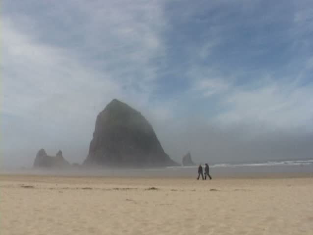 Time lapse of people and beach activity on Cannon Beach, Oregon.