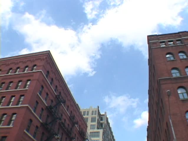 Time Lapse of New York City buildings in Greenwich Village and clouds passing.