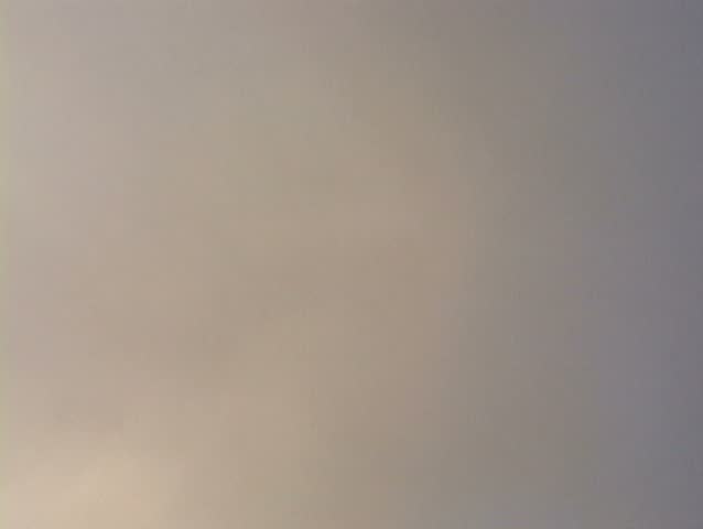 Great clouds during day turn to rain clouds at night with rain hitting lens.