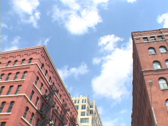 Time Lapse of New York City buildings in Greenwich Village and clouds passing.