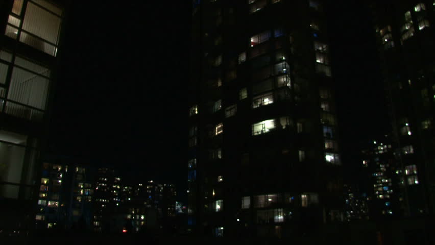 Time lapse of city life at night in Vancouver Canada showing many people in