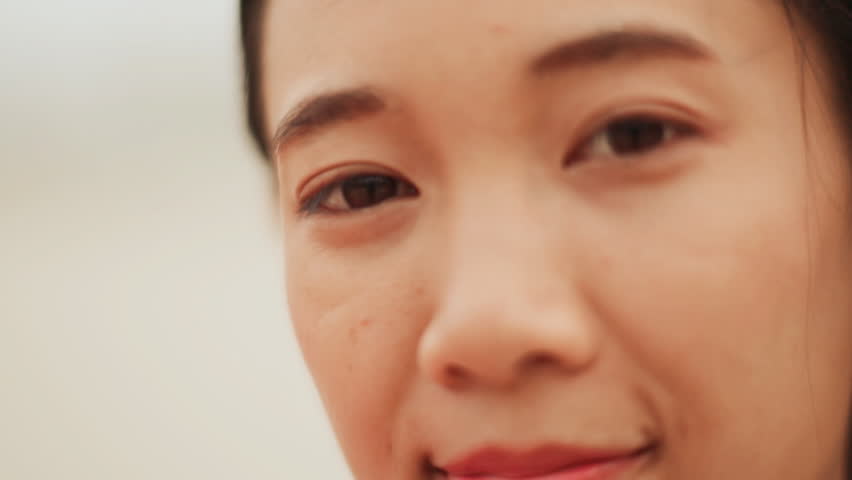 Face close-up. Charming Vietnamese Girl laughing.