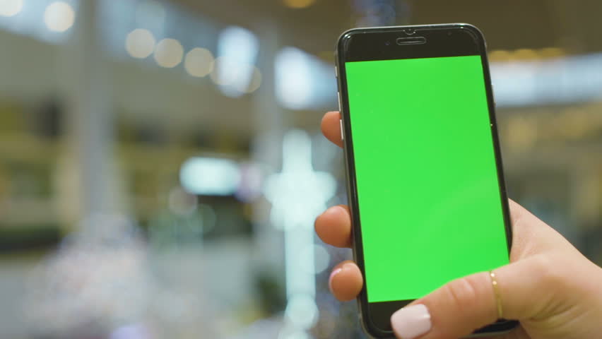 4K Close up of hand holding a smartphone with green screen display at underground train station. Shot on RED Epic. Royalty-Free Stock Footage #23597854