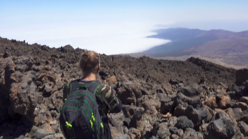 Man Is Looking Down On The Valley. Slow Motion
