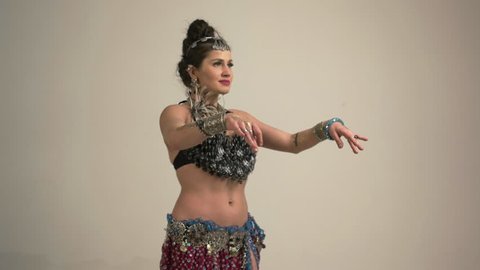 Woman dancer performs belly dance
