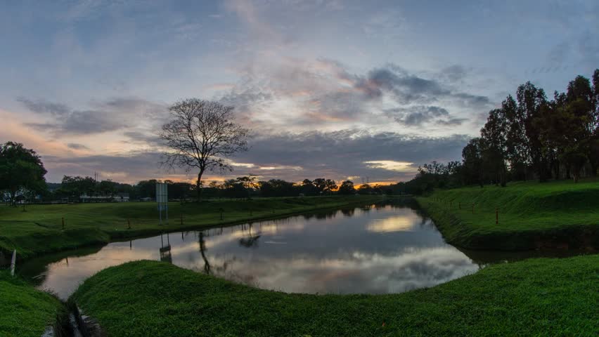 Sunrise at lake with clouds over the sky. 