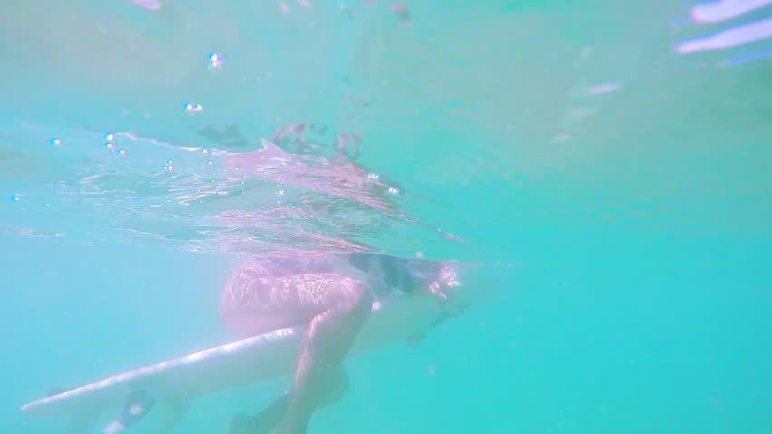 Beautiful Smile Surf Girl Sitting On Surfboard Underwater In Slow Motion | Shutterstock HD Video #23629336