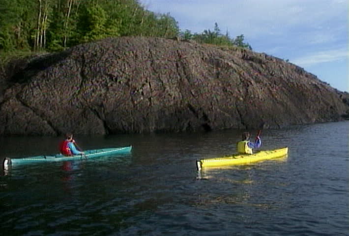 Kayaking along a rocky shoreline