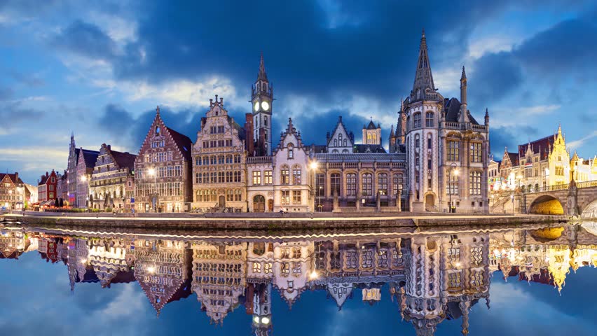 Ghent skyline reflecting in water in the evening, Belgium  (static image with animated sky and water)

