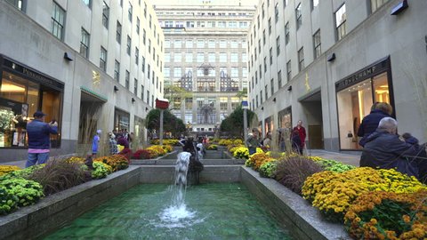 Rockefeller Center fountains, slider shot - October 2016. New York City street scene, United States