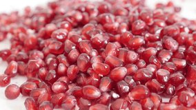 Pile of healthy Punica granatum fruit peeled shallow DOF 4K 3840X2160 UHD tilting video - Red seeds of Lythraceae family juicy pomegranate slow tilt  2160p UltraHD footage