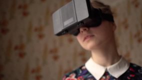 Portrait of beautiful young woman in VR headset at home