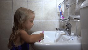 4K Child Brushing Teeth, Girl Portrait Washing Using Toothbrush in Bathroom