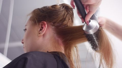 Hair-Saving Tips, Hairs Blow-Drying, the Best Technique. Slow Motion. Taken Down Up. Hair Care. the Hairs Are Separated Into Sections and Fixed Up. Salon Hair Treatment by Well Qualified Hairdresser.
