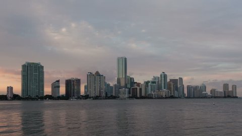 4K Timelapse Miami city skyline panorama at dusk with urban skyscrapers medium close up