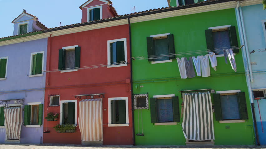 Multicolored street on Burano, famous vivid architecture, tourist attraction