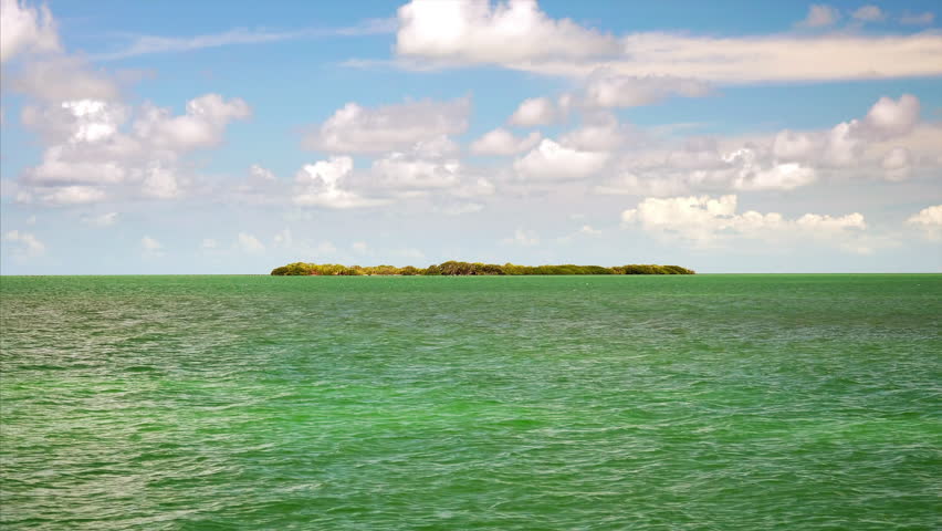 Exotic tropical island surrounded by ocean in the Florida Keys, timelapse
