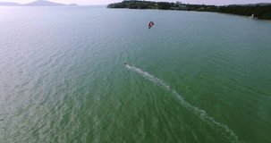 Aerial view kite surfing in tropical blue ocean 4K