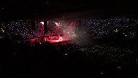 Thousands of children are singing your favorite song in night stadium with crazy lights,February 2017,4K