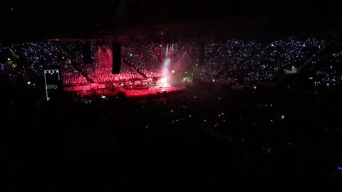 Thousands of children are singing your favorite song in night stadium with crazy lights,February 2017,4K