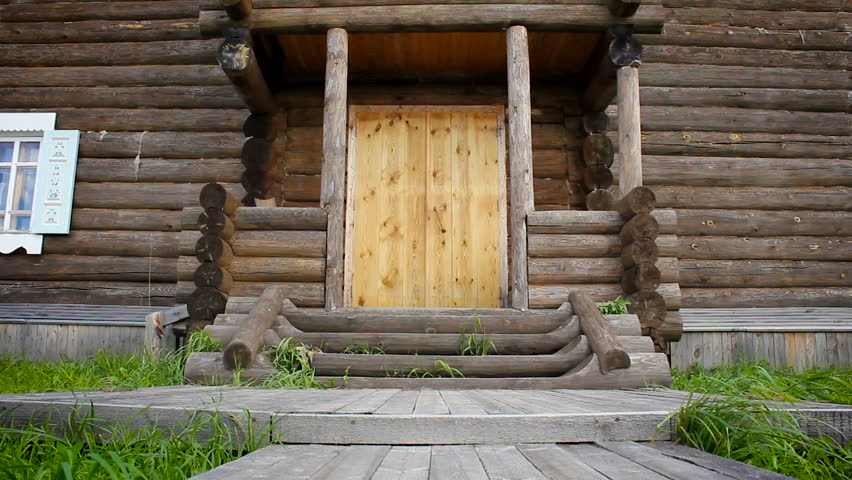Two-storey wooden house, view of the front porch and veranda. HD
