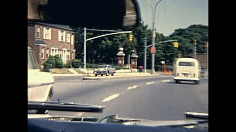 New York, United States of America - circa 1970: point of view tourist of driving car across New York city traffic in 70's. Vintage cars on the road.