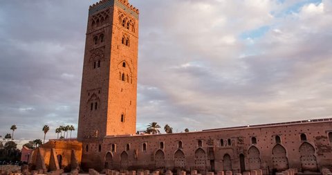 Timelapse Koutoubia Mosque in Marrakech at sunset on background of clouds, Morocco