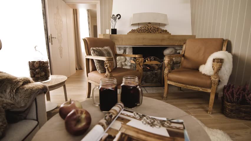 Elegant hotel room with fireplace and hot wine 