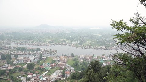  Srinagar in India lies on the banks of the Jhelum River, a tributary of the Indus, and Dal lake, famous for its gardens, waterfronts and houseboats/ View of Srinagar and Dal Lake/ Jammu and Kashmir