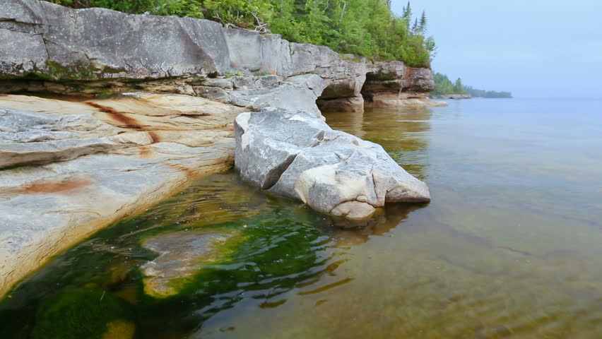 Loop features a rocky, Upper Peninsula Michigan coastline on Lake Superior near Munising.