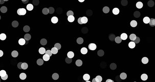 Bokeh lights random dots video footage on black background for screen blending mode