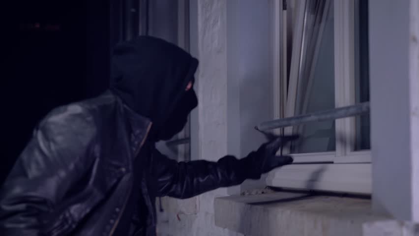 masked burglars breaking and entering into a victim's home Royalty-Free Stock Footage #23767951