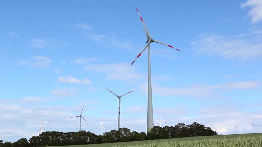 Time-lapse of windmill spinning on a cloudy day