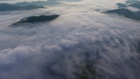 Aerial view of the fog over mountains
