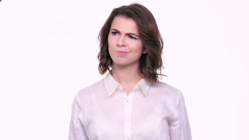 Young confused woman shrugging shoulders isolated on a white background | Shutterstock HD Video #23786761