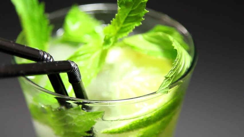 Mojito cocktail on black background rotation