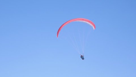 A para glider landing after an enjoying flight...
