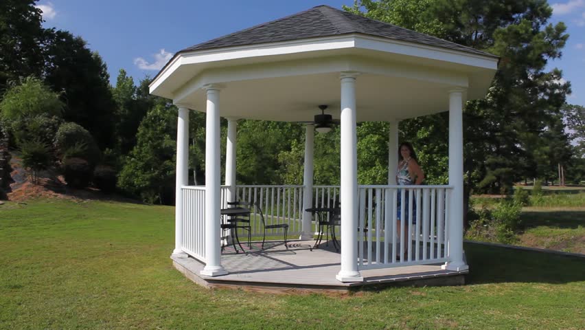 Wide View Of Attractive Lady At Gazebo Walking Off And Away