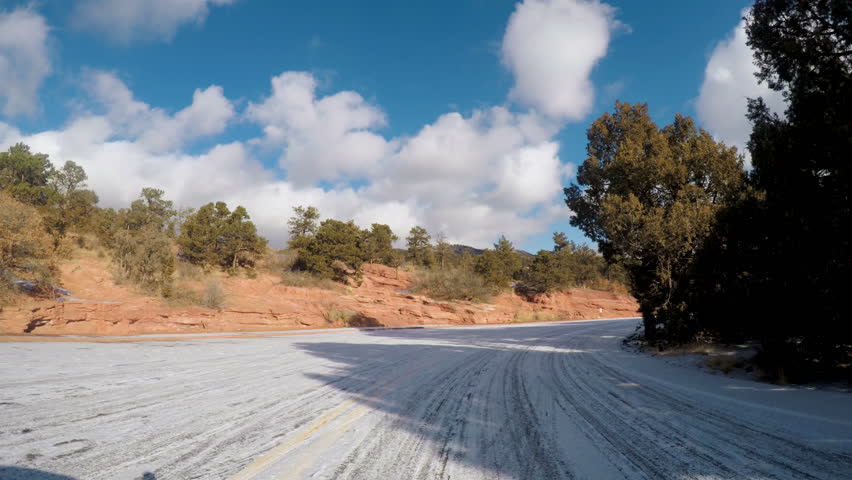 Time-lapse. POV point of view - Driving through Garden of the Gods on late morning in the Winter.