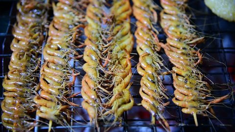 Grilled small river shrimps on Stove Thai Style for sale , Thailand.
