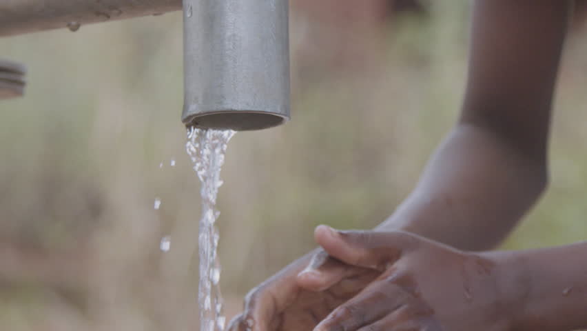 People using the water pump East Africa Malawi Royalty-Free Stock Footage #23818564