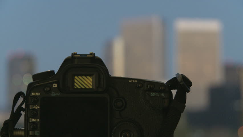 Camera with skycrapers of Los Angeles in the background during morning twilight