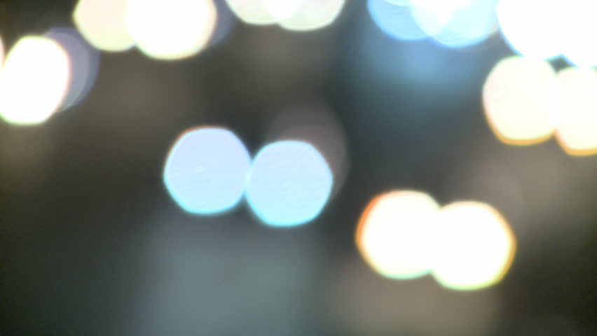 Defocus to focus and back to defocus of Highway Traffic at night with carlights