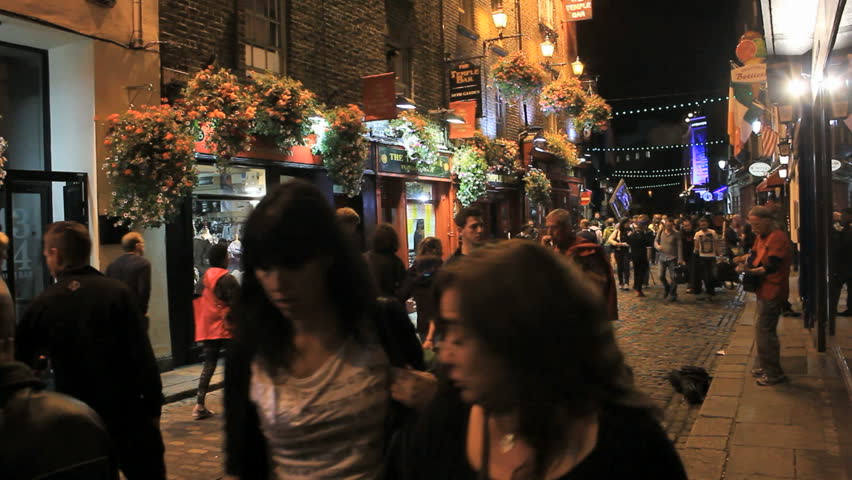 People walking on Temple Bar at night, promoted as "Dublin