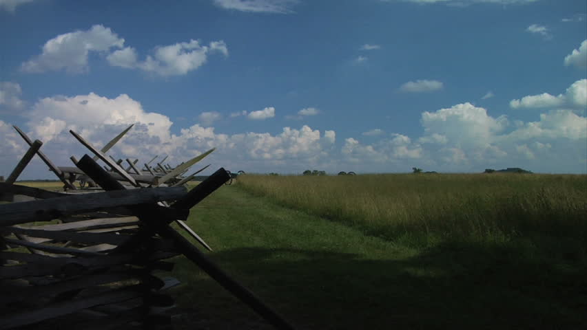 GETTYSBURG, PENNSYLVANIA - JULY 2013 - large-scale, epic Civil War anniversary. Gettysburg National Battlefield Park landscape with fences, cannons, monuments and wide open fields. National Park.