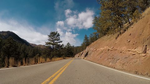 POV point of view - Driving through Pike National Forest in the Winter.